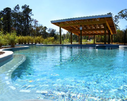 Lazy river swim-up bar at Fireside RV Resort campground in Robert, Louisiana