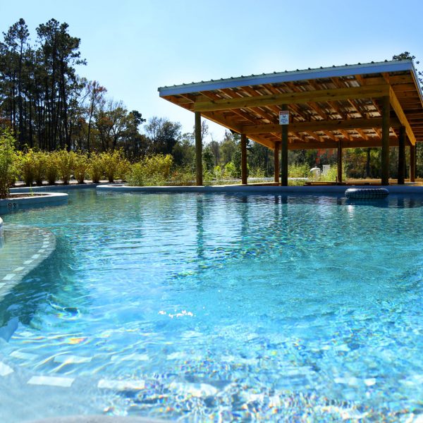 Lazy river swim-up bar at Fireside RV Resort campground in Robert, Louisiana