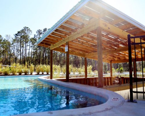 Lazy river swim-up bar at Fireside RV Resort campground in Robert, Louisiana