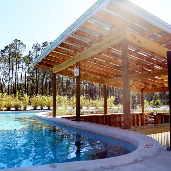 Lazy river swim-up bar at Fireside RV Resort campground in Robert, Louisiana